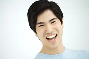 Asians Prints: Young man laughing, portrait