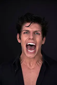 Caucasians Prints: Young man with his mouth wide open