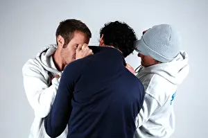 Two young men beating up a young man
