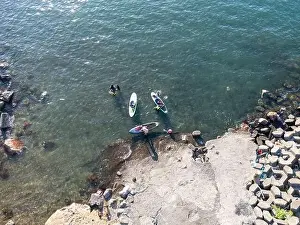 Surfboard Prints: Young people enjoying marine sports such as SUP in Keelung City, Taiwan. September 2024