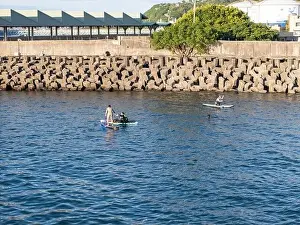 Surfboard Prints: Young people enjoying marine sports such as SUP in Keelung City, Taiwan. September 2024