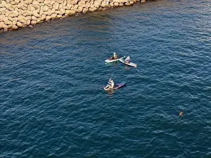 Surfboard Prints: Young people enjoying marine sports such as SUP in Keelung City, Taiwan. September 2024