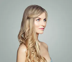 Hairdo Prints: Young perfect blonde woman with long healthy curly hair