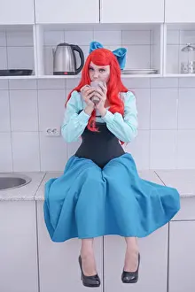 Mermaid Prints: young red hair girl in blue dress with black corset on the kitchen