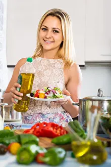 Cookbook Prints: young russian girl standing at kitchen table with plate of salad