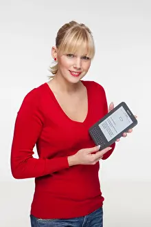 Reader Prints: Young sexy blonde woman with her Kindle e-book reader