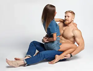 young sexy woman on top brutal young guy with beard isolated on white background
