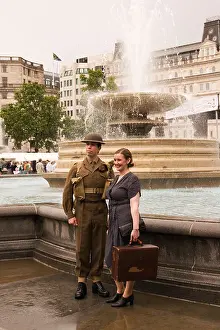 Young Adults Prints: Young soldier in WWII uniform with wife in Trafalgar Square London