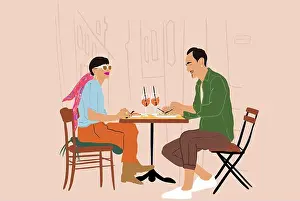 Dating Prints: Young stylish couple having lunch while sitting together at restaurant terrace on the city street