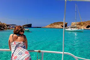 Holiday Makers Prints: A young woman at The Blue Lagoon, Comino. Gozo. Malta