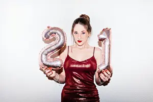 Adulthood Prints: Young woman celebrating her 21st birthday illuminated with hard flash light