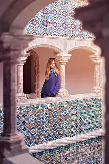 Contemplating Prints: Young woman contemplating the courtyard of Quinta da Regaleira in Sintra, Portugal