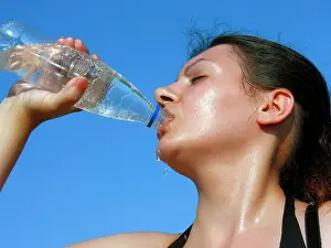Sweat Prints: Young woman drinking cold water