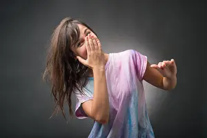 Shocked Prints: Young woman with hand over mouth