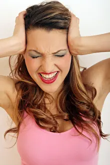 One Young Woman Only Prints: Young woman with a pained expression