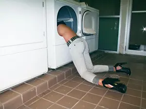 Housewife Prints: Young woman stuck in a washing machine