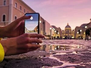 Images Dated 19th October 2019: Young woman traveler tourist taking beautiful landscape photo of european sunset during holiday