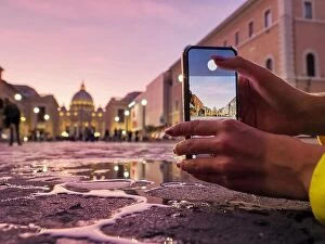 Images Dated 19th October 2019: Young woman traveler tourist taking beautiful landscape photo of european sunset during holiday