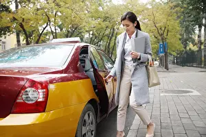 Only Women Prints: Young women go to work by taxi