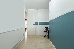Bedding Prints: Youth bedroom with folding bed and desk in its folded position and built-in wardrobe with matching colors