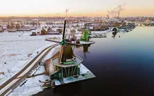 Zaanse Schans windmill village during winter with snow landscape in the Netherlands Holland village in winter