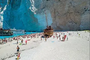 Noon Prints: Zakynthos, Greece - August 20, 2019: Aerial drone shot of tourists on Zakynthos Shipwreck Navagio beach