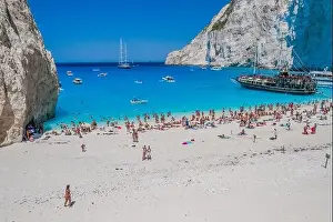 Noon Prints: Zakynthos, Greece - August 20, 2019: Aerial drone shot of tourists on Zakynthos Shipwreck Navagio beach