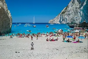 Noon Prints: Zakynthos, Greece - August 20, 2019: Aerial drone shot of tourists on Zakynthos Shipwreck Navagio beach
