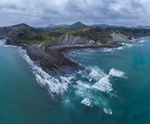 Cantabrian Prints: Zumaia and Deba flysch geological strata layers drone aerial view, Basque Country
