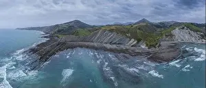 Zumaia and Deba flysch geological strata layers drone aerial view, Basque Country